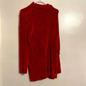 A very nice holiday sweater, has a knitted corduroy texture .